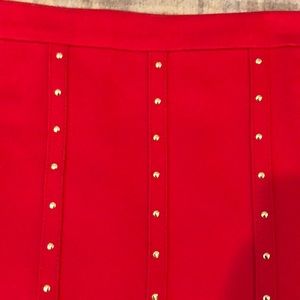 Calvin Klein skirt. Cute gold detailing.